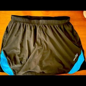 NWOT Black women’s Saucony skort. Worn once. Perfect condition.